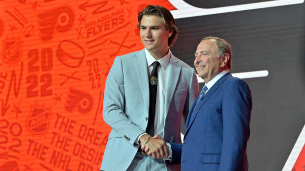 Cutter Gauthier shakes Gary Bettman’s hand at the NHL draft.